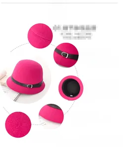 Detail view of rose red felt hat with black leather strap and metal buckle accent