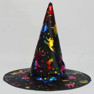 Detail view of black witch hat featuring metallic gold pumpkin and bat patterns