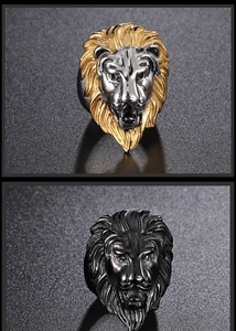 Detailed view of embossed lion head rings in bicolor gold and black metallic finishes
