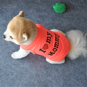 Detail of orange puppy vest featuring black I Love my Mommy print and red heart