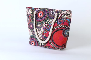Close-up of bohemian canvas tote bag with mandala print and thick cotton rope handles