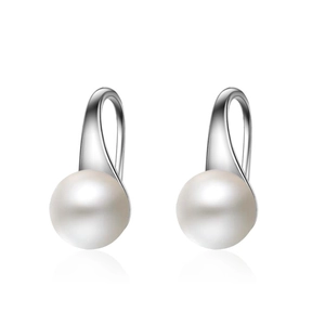 Elegant white pearl drop earrings with silver metal hooks on white background