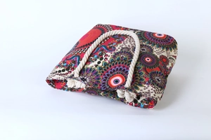 Close-up of bohemian mandala print tote bag with thick cotton rope handles and metal eyelets