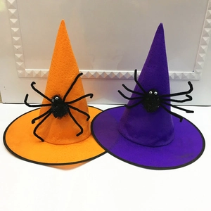 Detail of orange and purple Halloween wizard hats with black plush spider decorations