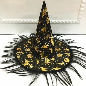 Detail of black wizard hat with gold foil patterns and black feather trim for Halloween