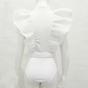 Detailed back view of white one-piece swimsuit featuring ruffled hem and matching waist belt
