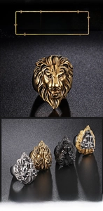 Detail of vintage embossed lion head rings in gold, silver, and black stainless steel