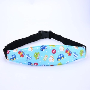Close-up of blue car-patterned toddler car seat head support strap with black buckle