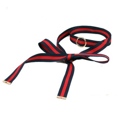 Detail of fabric neckband with navy and red stripes featuring gold metal buckle