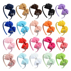 Detailed grid showing 20 colorful ribbed ribbon bow headbands for children in various shades