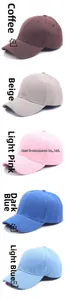Detailed stack of cotton baseball caps in coffee, beige, pink, and various blue shades