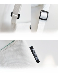 Detail of adjustable 1.3m cotton strap with black plastic buckle and Mixiang Bag logo label