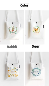 Detail view of four small canvas crossbody bags with animal prints and metal snap buttons