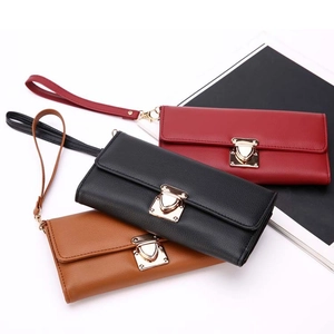 Three long PU leather wallets in red black and brown with wrist straps and metal clasps