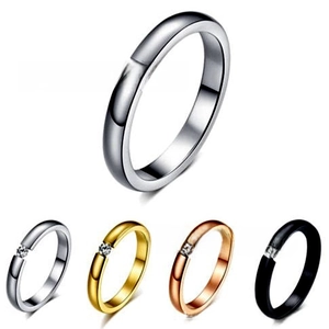 Detailed view of minimalist open rings set in silver, gold, rose gold and black colors