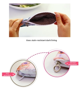 Detail of fish pencil case with upgraded circular metal zipper and polka dot lining