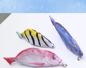 Detailed view of realistic fish-shaped pencil cases in various colors with zipper closure