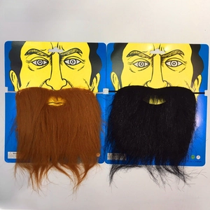 Detail of assorted black, white, and khaki costume beards on card packaging for Halloween