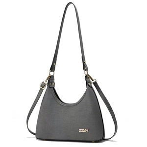 Gray textured fabric crescent shoulder bag with black leather straps and gold metal logo