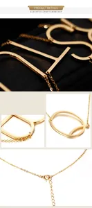 Macro shot of gold uppercase initial pendant with adjustable O-chain and lobster clasp