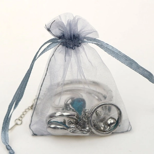 Blue organza drawstring pouch for jewelry packaging with semi-transparent fabric mesh