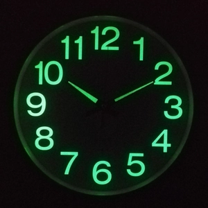 12-inch luminous wall clock with glow-in-the-dark green numerals and quartz movement