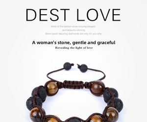 Detailed view of 12mm tiger eye and volcanic stone beads with hand-woven adjustable cord