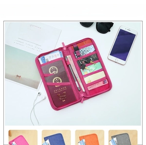 Macro detail of rose red travel passport wallet with multiple card slots and key holder