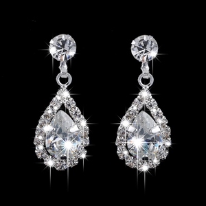 Sparkling silver teardrop earrings with halo rhinestones and zircon on black background