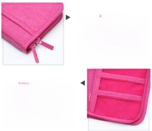Detail view of pink document organizer with mesh card slots and double metal zippers