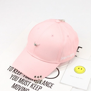 Pink cotton baseball cap featuring silver metal rings on brim and ball pin decoration