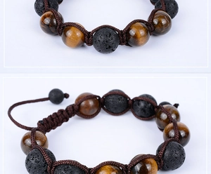 Detail view of woven lava rock and tiger eye stone beads with adjustable knot cord