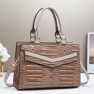Brown crocodile embossed patchwork tote bag with gold hardware and shoulder strap
