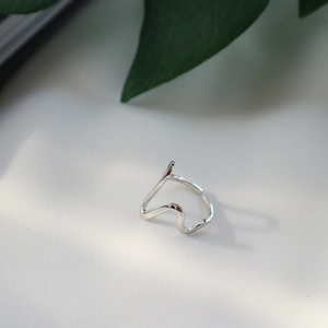 Detailed view of irregular wavy S925 sterling silver ring with authentic hallmark stamp