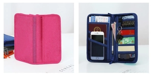 Detail view of multi-purpose travel wallet showing interior slots and zippered pockets