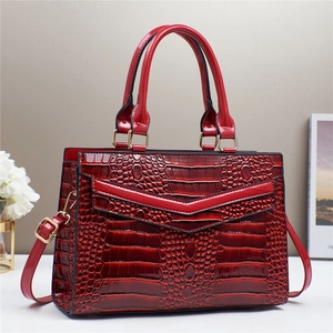 Elegant red crocodile embossed faux leather tote bag with gold hardware and shoulder strap