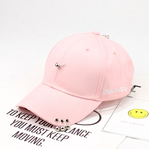 Detail of pink cotton baseball cap with silver metal rings and Japanese embroidery