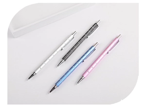 Macro shot of four checkered metal mechanical pencils in silver, black, blue, and pink colors