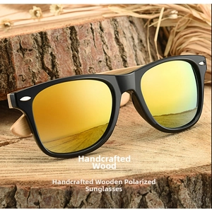 Detail of natural bamboo temples on retro polarized sunglasses with gold mirrored lenses