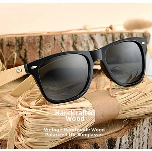 Detail of vintage sunglasses with natural bamboo temples on rustic wooden background