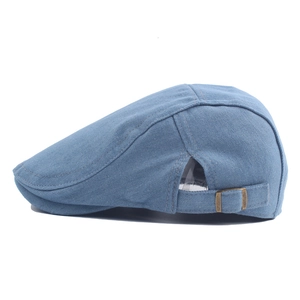Unisex light blue washed denim beret cap with adjustable metal buckle on white background