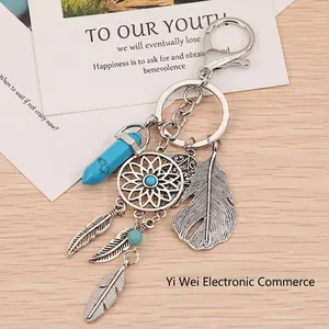 Handmade dreamcatcher keychain with silver feathers and blue turquoise opal stone pendant