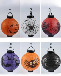 Detail view of hanging Halloween paper lanterns with pumpkin, bat, and skull patterns
