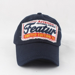 Close-up of vintage Arizona patch embroidery on navy blue washed cotton baseball cap
