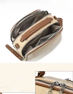 Detail view showing multi-compartment interior and silver zippers of beige crossbody bag