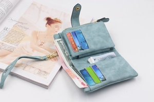 Detail of light blue matte wallet showing interior card slots and zippered coin pouch