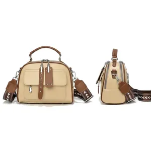 Detailed view of beige and brown crossbody bag with size 22x11x17cm and 5 compartments