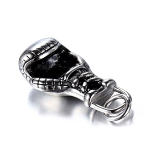 Detailed macro view of vintage silver boxing glove pendant with realistic weathered finish