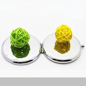 Polished silver metal compact mirror with dual folding design and HD reflection