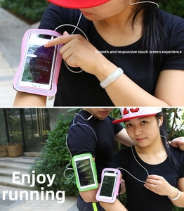 Close-up of touch-sensitive screen and outdoor use of pink and green sports armbands
